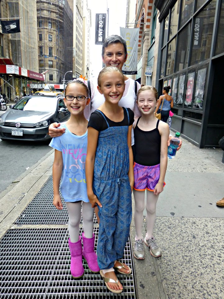 on the sidewalk in front of 890 Broadway with three of my students in August 2012