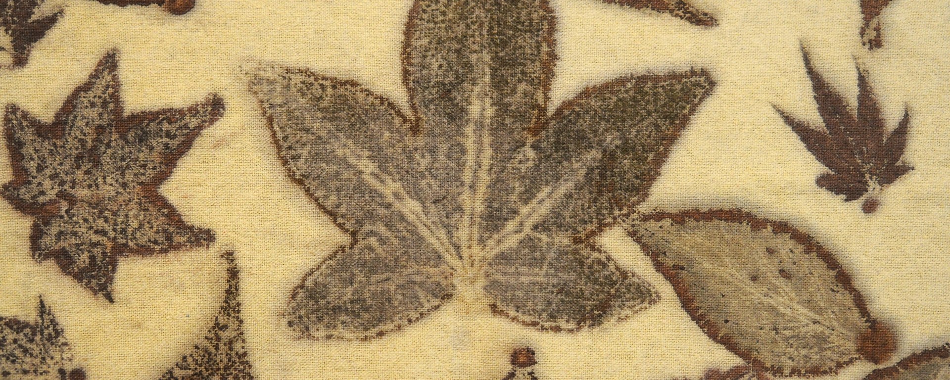 detail of a leaf on an iron blanket used to transfer organic material to another fabric