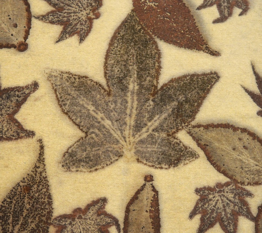 detail of a leaf on an iron blanket used to transfer organic material to another fabric