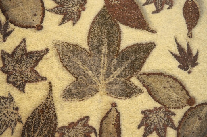detail of a leaf on an iron blanket used to transfer organic material to another fabric